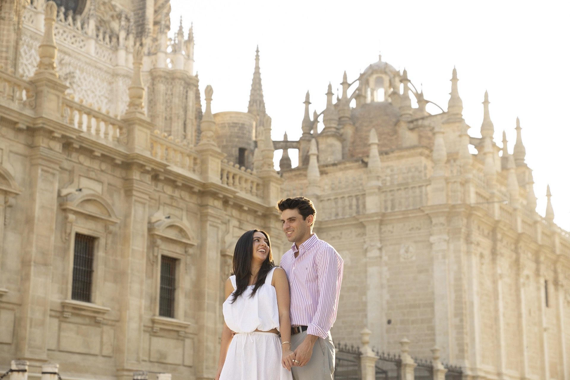 Couple by the Guadalquivir in Triana, Seville at golden hour