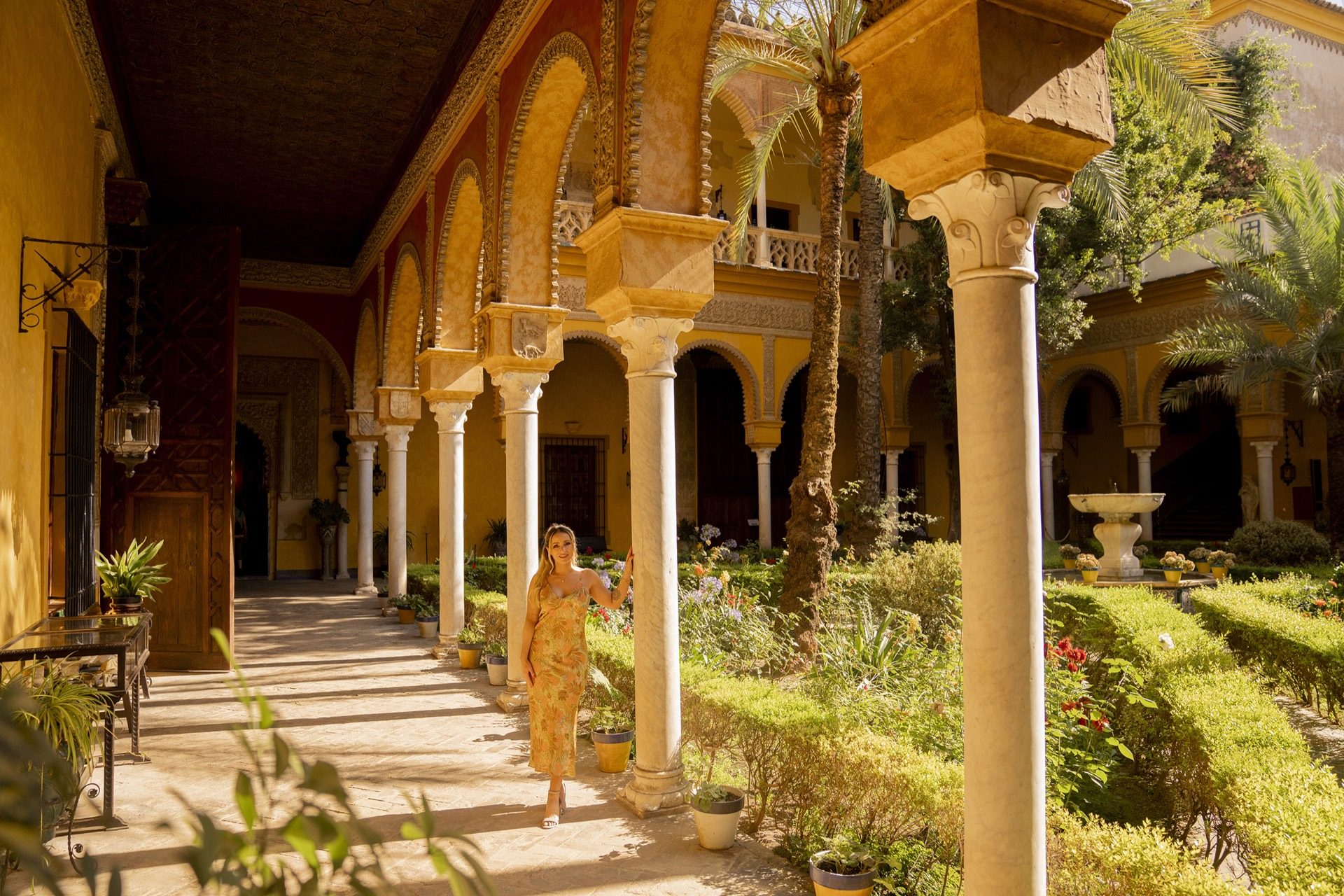 Portrait session in a historic Seville palace courtyard
