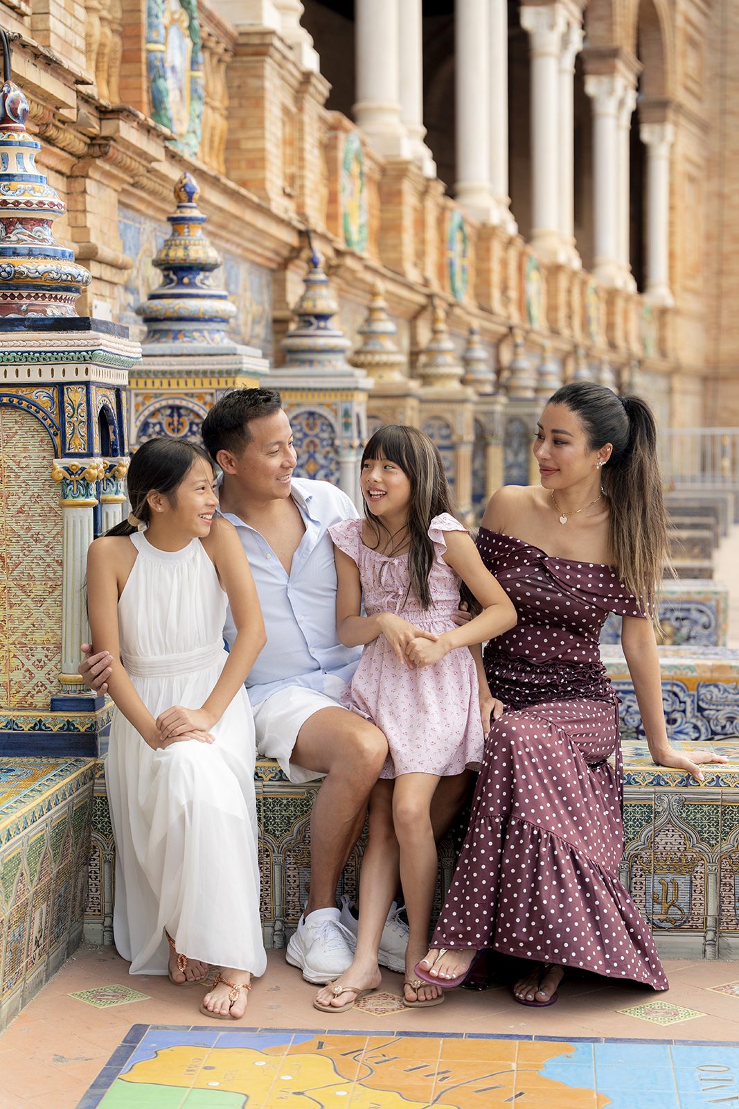 Family portrait on the tiled alcoves of Plaza de España